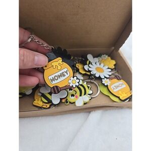 Game On Party Supplies Favors Bees Wristbands and keychains.